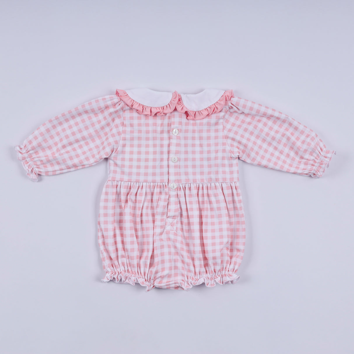 Pink gingerbread hand smocked gingham ruffle bubble