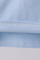 Blue construction embroidery top