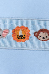 Blue animal smocked top