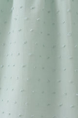 Green swiss dot cross sheep ruffle dress