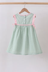 Green swiss dot cross sheep ruffle dress