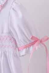 White cross smocked ruffle dress