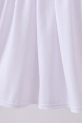 White cross smocked ruffle dress