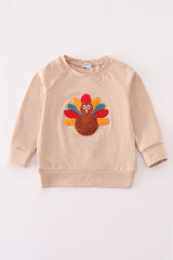 Beige turkey french knot top