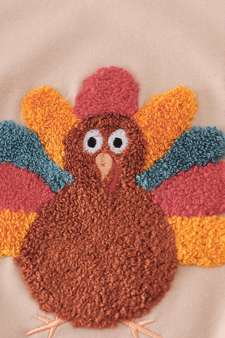 Beige turkey french knot ruffle top