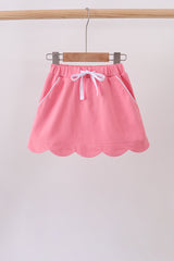 Deep pink scallop hem bow skort