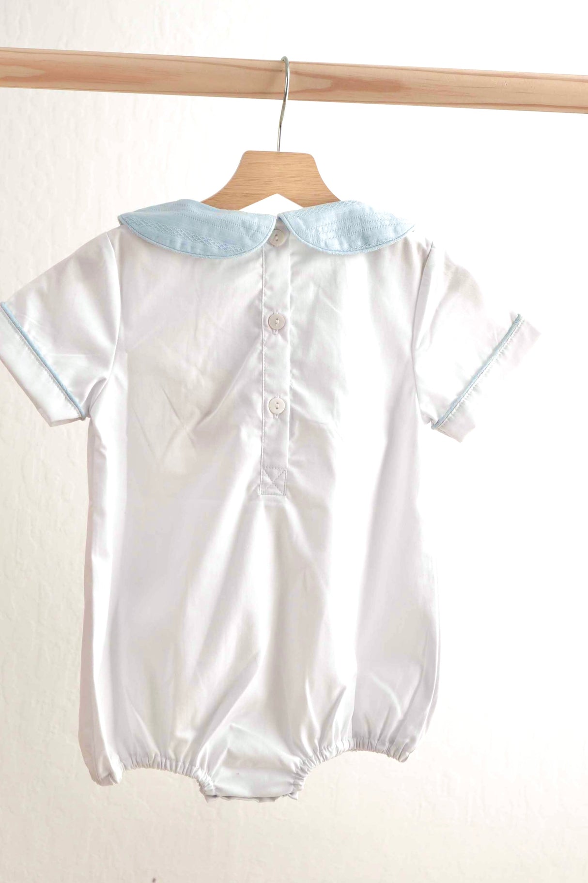 Blue easter cross hand-smocked boy bubble