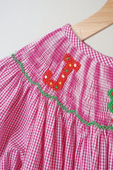 Pink christmas joy hand smocked gingham dress