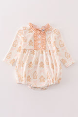 Beige gingerbread girl ruffle bubble