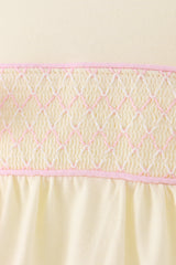 Cream smocked bow bubble