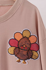 Khaki turkey sequin mom top